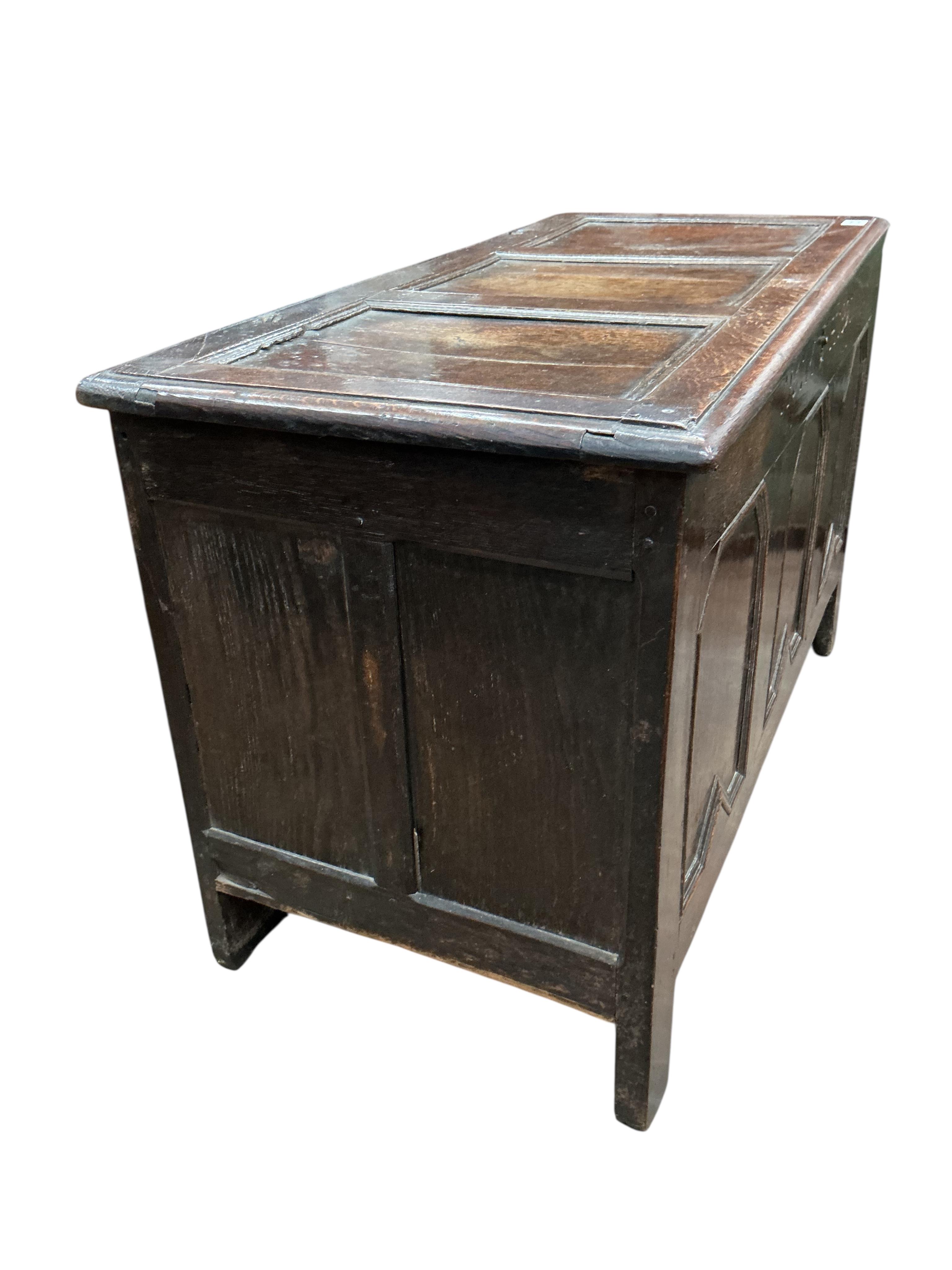 A late 17th century panelled oak coffer, dated 1686, width 116cm, depth 54cm, height 71cm